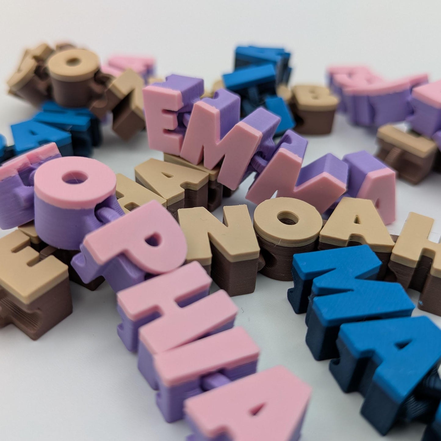 Gepersonaliseerde beweegbare naam-sleutelhanger