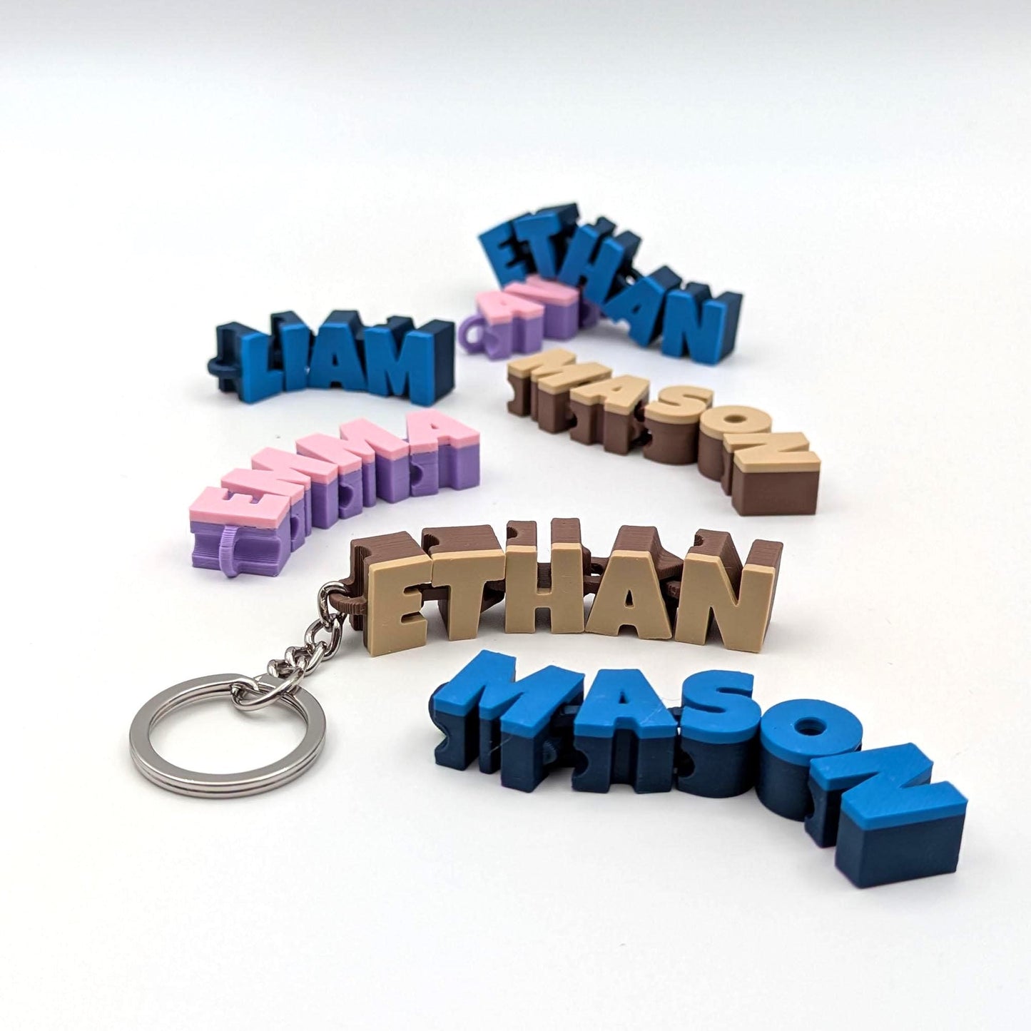 Gepersonaliseerde beweegbare naam-sleutelhanger