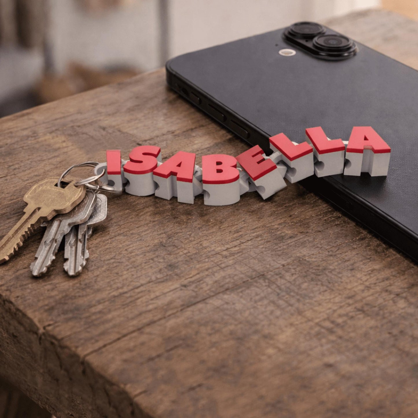 Gepersonaliseerde beweegbare naam-sleutelhanger